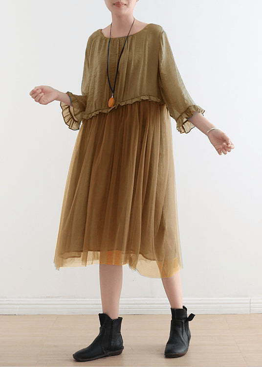 Woman walking in layered tulle dress showing movement and drape of midi-length skirt