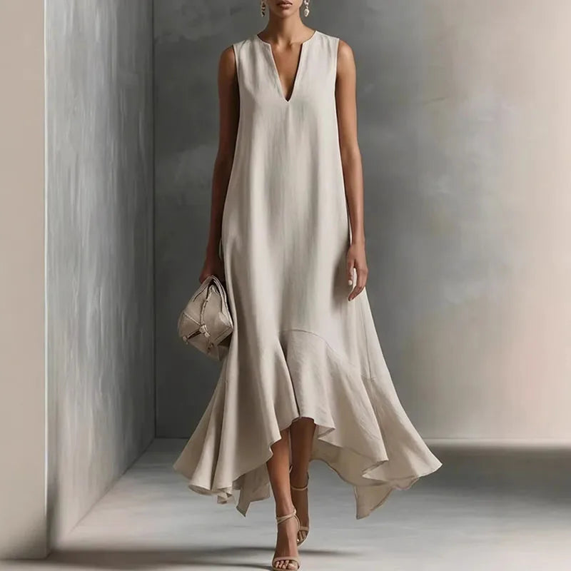 Genesis V Neck Flowy Sundress in beige with deep V-neckline and asymmetric ruffle hem, sleeveless maxi dress for summer