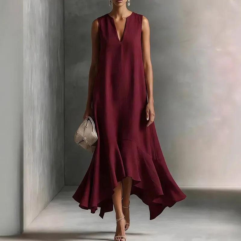 Full body shot of V Neck Flowy Sundress paired with strappy heels, showcasing maxi length and relaxed fit