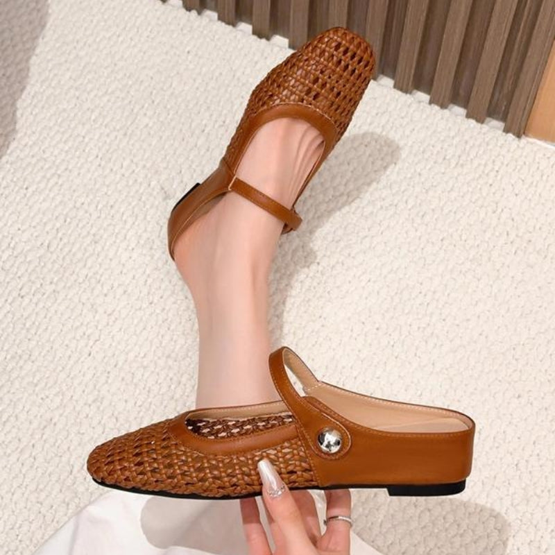 Full view of Mary Jane mules showing breathable woven pattern and adjustable strap design