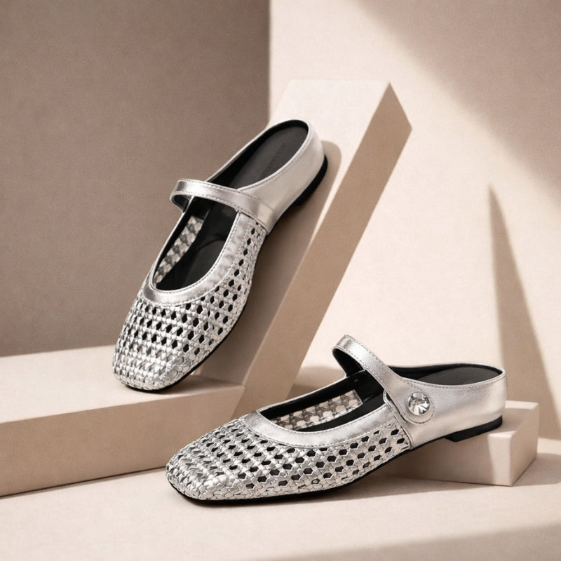 Side view of women's slip-on mules with open-weave construction and classic Mary Jane strap detail
