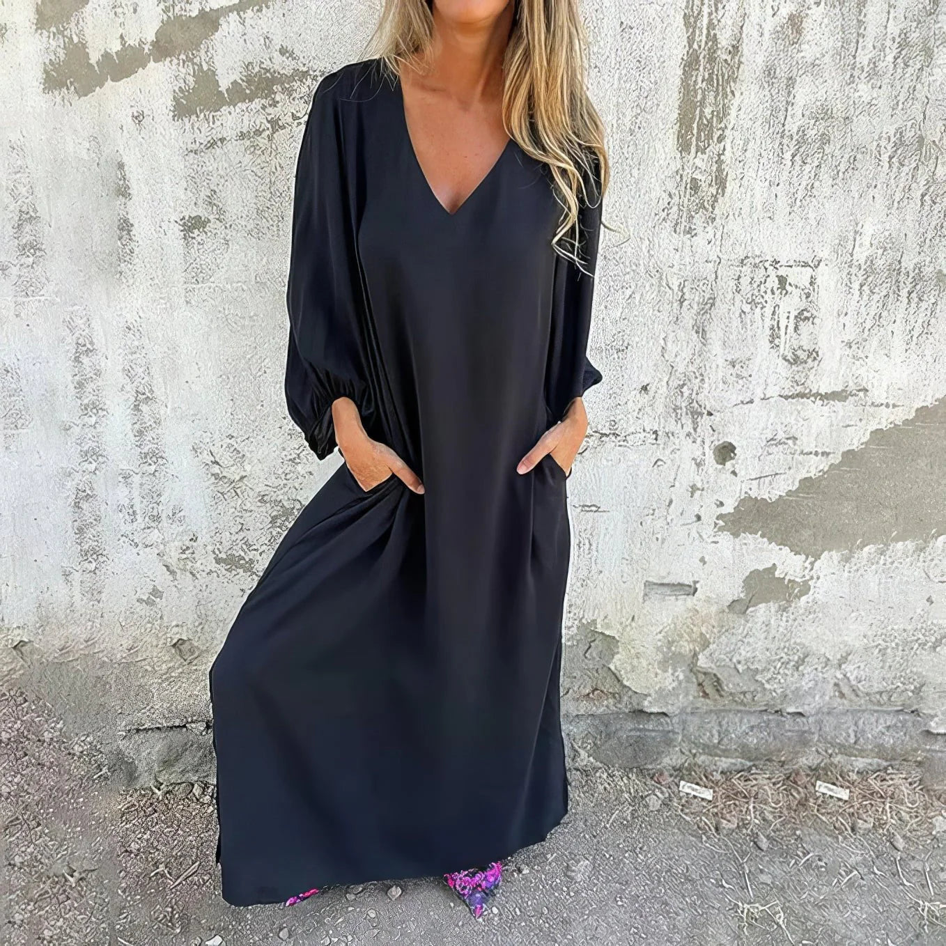 Side view showing the flowing silhouette and relaxed fit of the maxi dress with hidden pockets