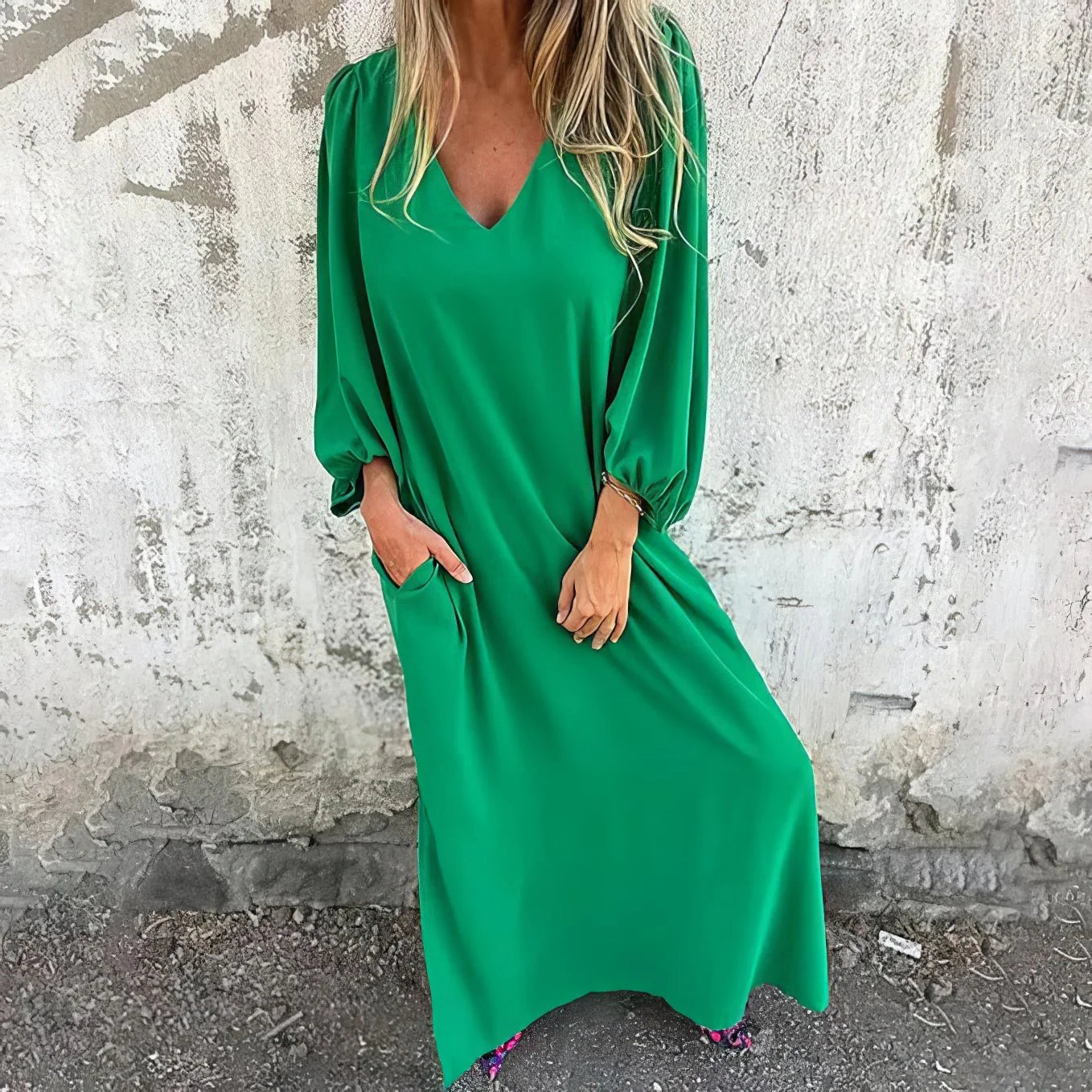 Full-length view of the red maxi dress styled with patterned sandals for casual wear