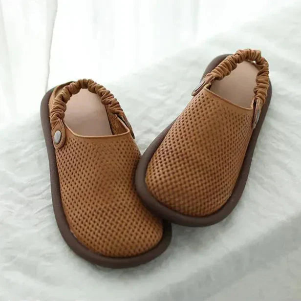 Detail view of arch support footbed and cushioned insole on women's sandals