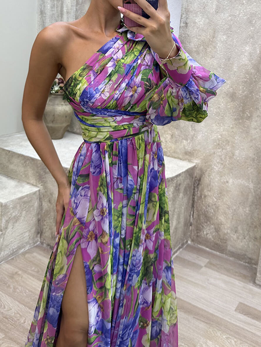 Summer wedding guest dress featuring vibrant floral print, fitted bodice, and sweeping maxi skirt