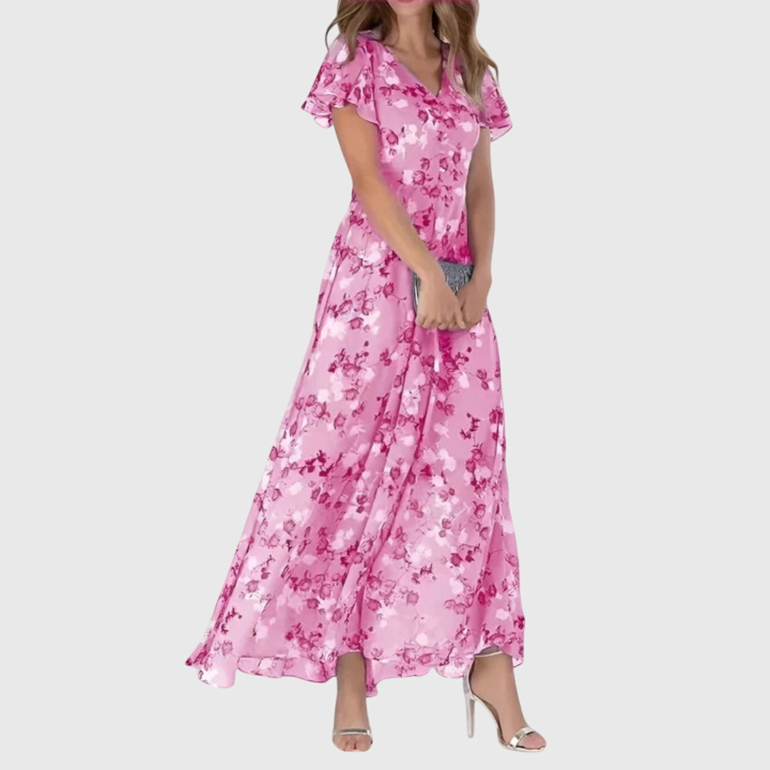 Full-length view of floral maxi dress with ankle-length hem and feminine flutter sleeves