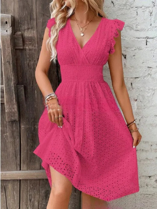 Close-up of smocked elastic waistband and eyelet pattern on summer dress bodice