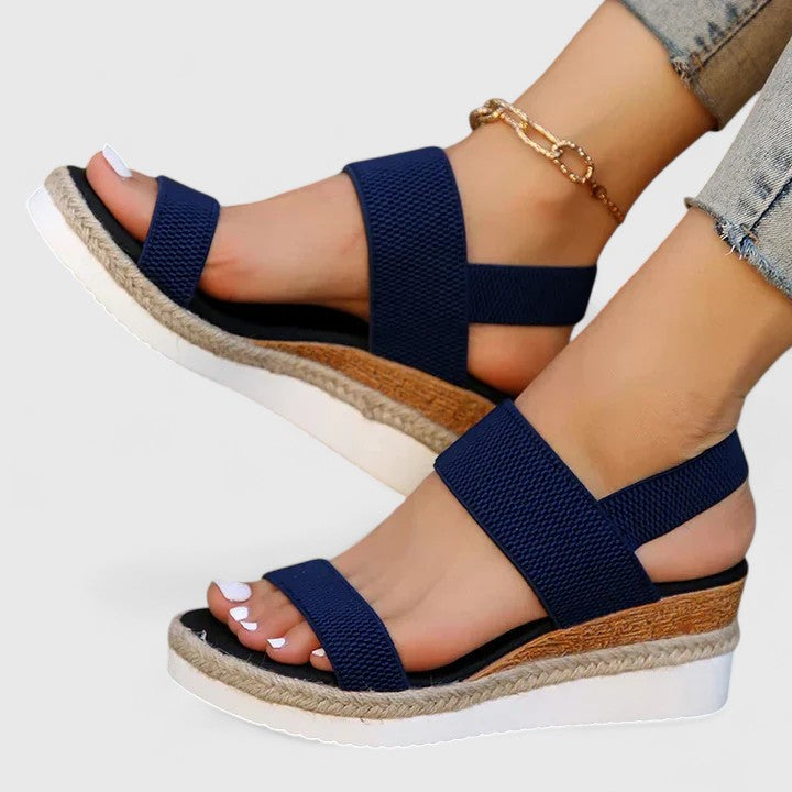 Women's slip-on sandals with slingback closure and espadrille-wrapped platform base in neutral beige tone
