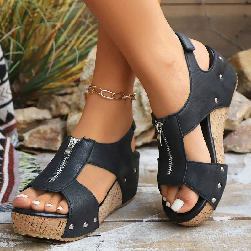 Cork-style wedge sole sandals with wide forefoot straps and adjustable zip fastening
