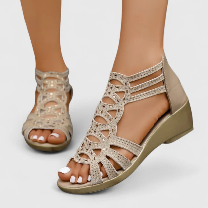 Close-up of orthopedic sandal construction with cutout pattern and cushioned arch support footbed