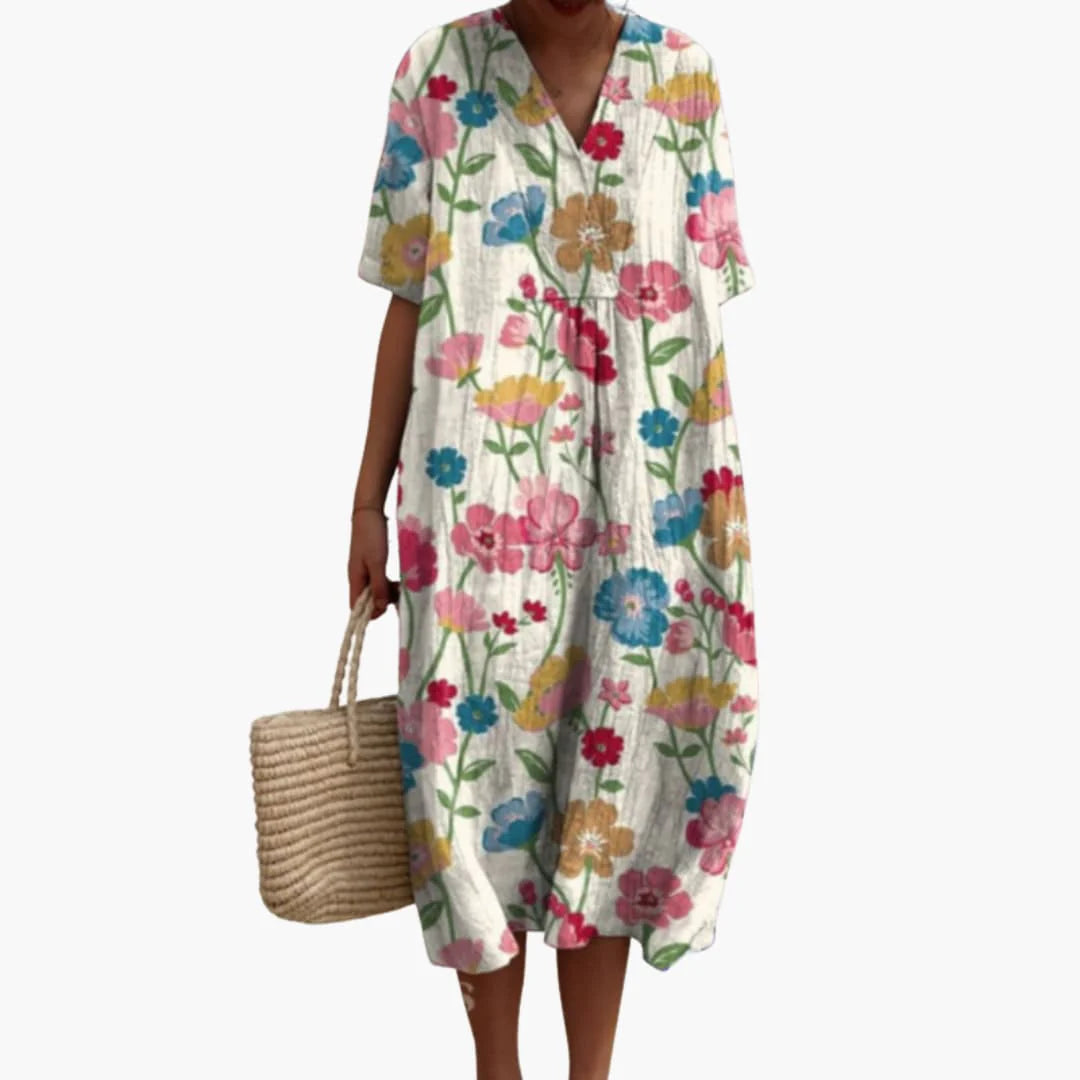 Madison wearing a vibrant floral print oversized midi dress with V neckline and short sleeves