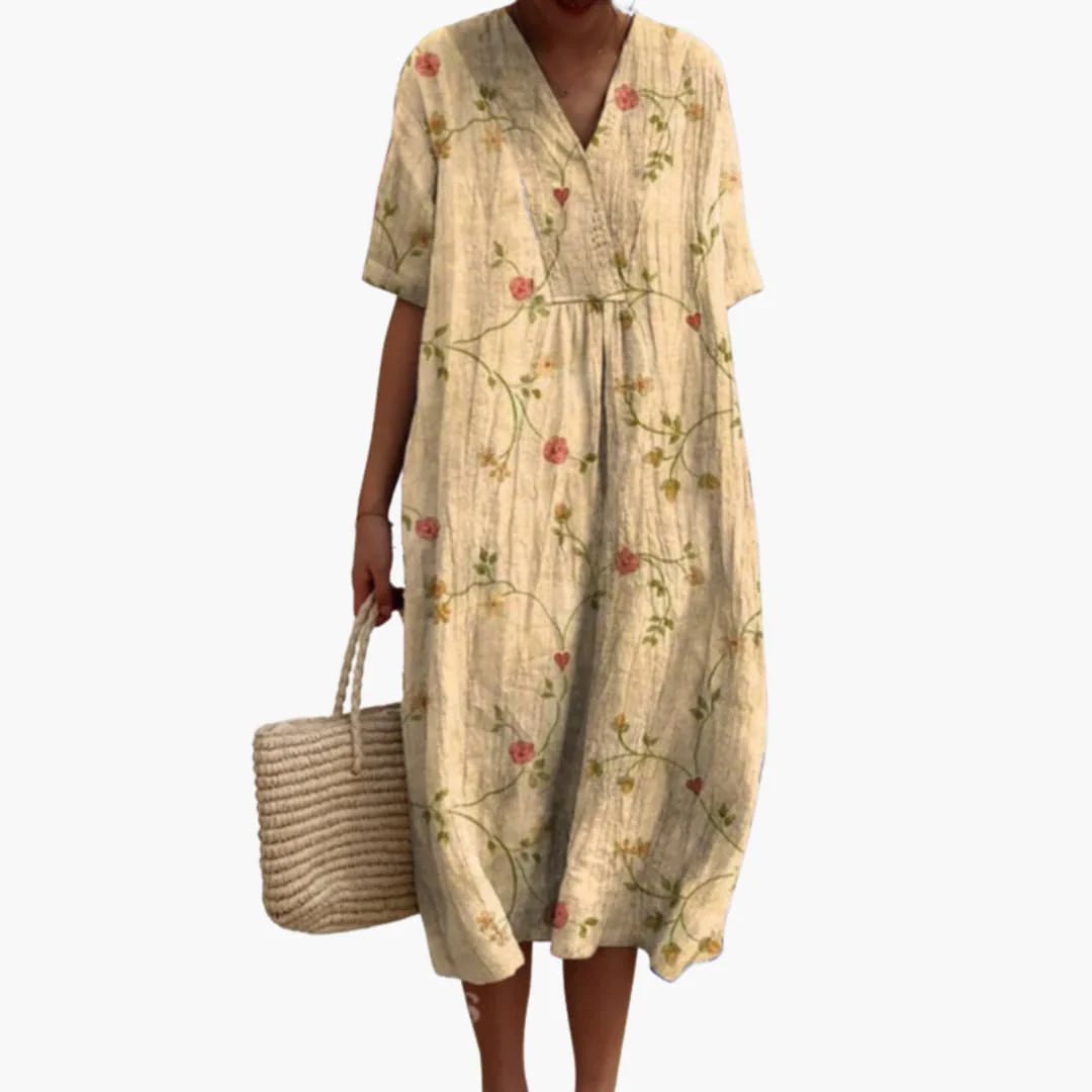 Below-knee length view of oversized midi dress with rounded hemline and side pockets