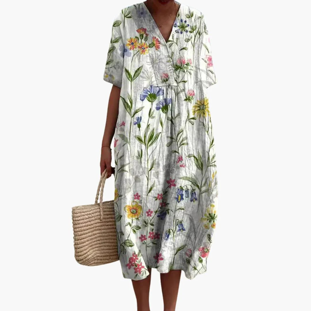 Detail shot of deep side pockets on floral midi dress with crinkle fabric texture