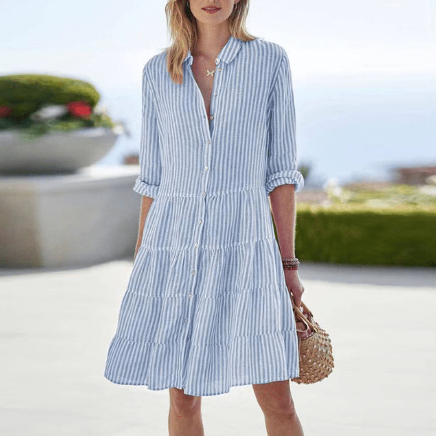Women's Striped Button Front Midi Dress in blue and white vertical stripes with tiered silhouette and roll-tab sleeves