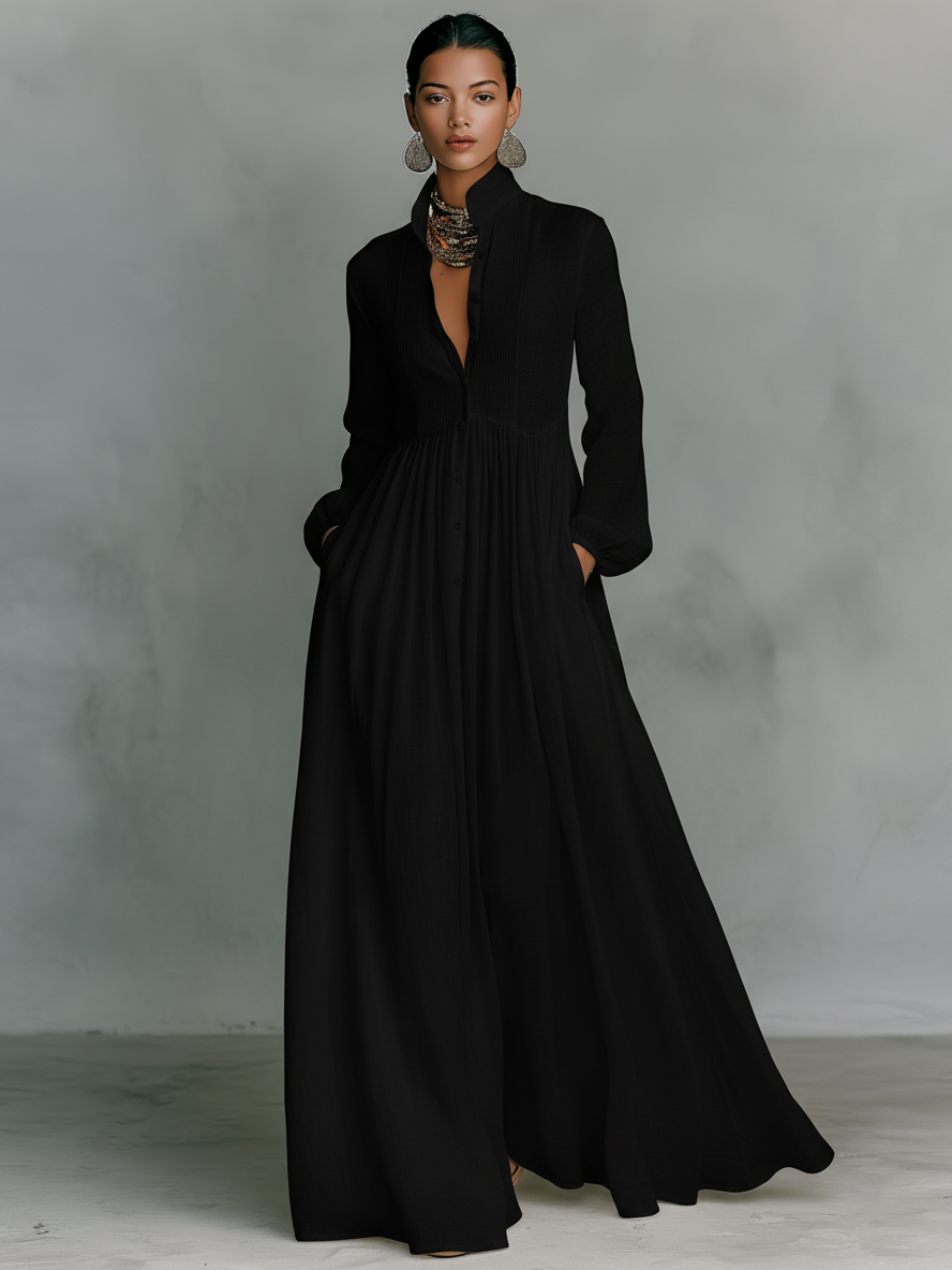 Close-up of stand collar and button-front closure on white maxi dress