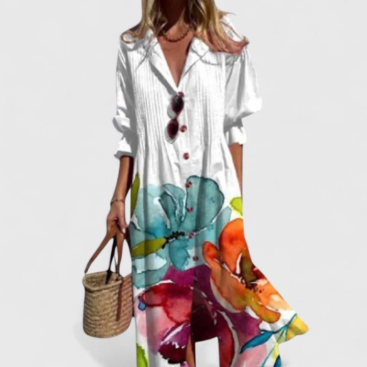 Close-up view of botanical leaf print pattern on lightweight maxi dress with rolled sleeves