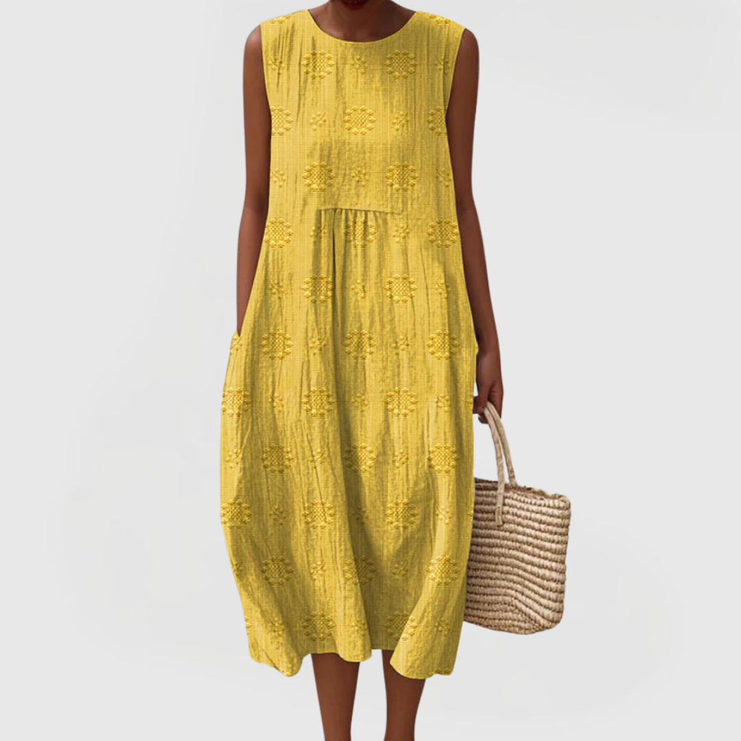 Woman styling green embroidered linen midi dress with woven basket tote for casual summer look