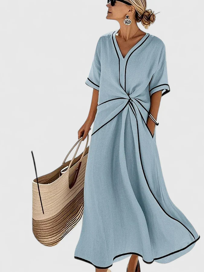 Side view of Summer Linen Dress showing flowing A-line midi skirt with contrast hem trim