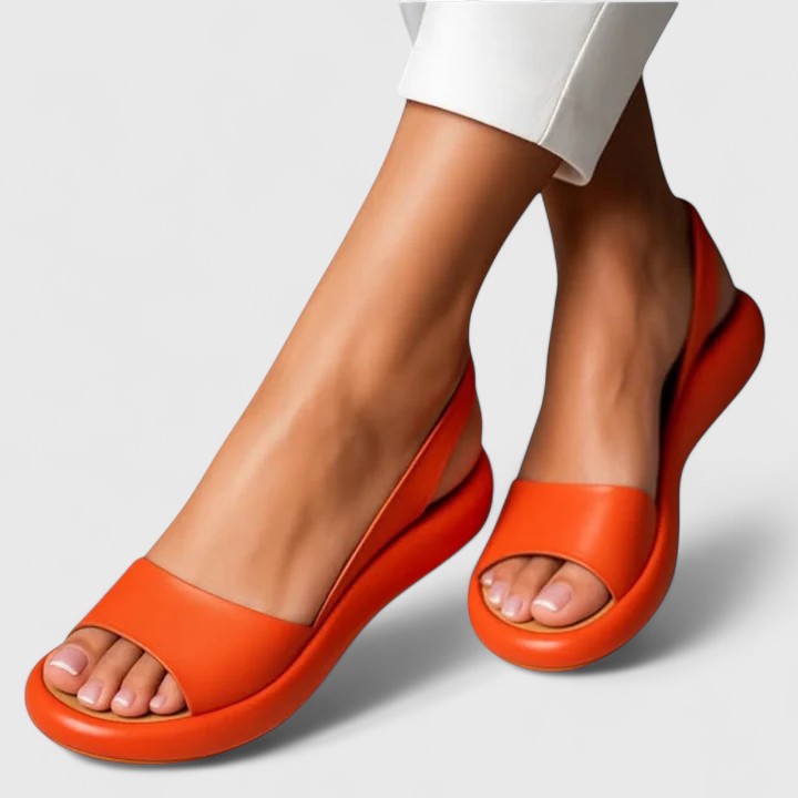 Side view of orthopedic sandals showing contoured footbed and shock-absorbing sole with open-toe silhouette