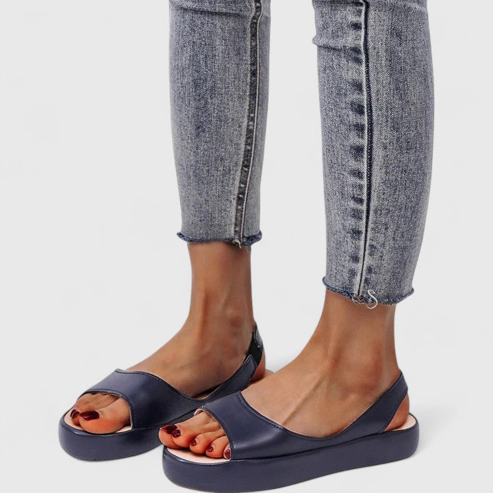 Blue orthopedic sandals with open-toe design and supportive footbed for comfortable daily wear