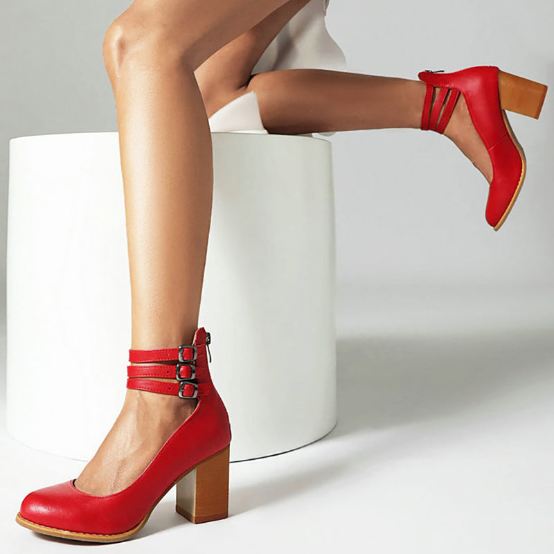 Close-up of buckle closure and ankle strap detail on smooth block heel sandals