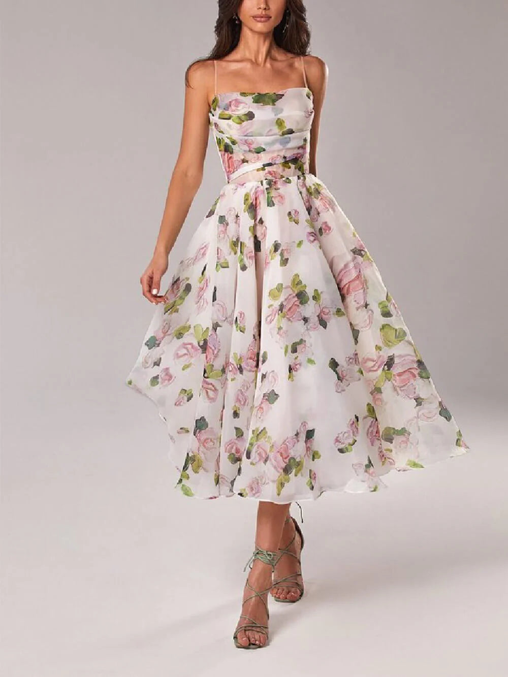 Elegant midi dress with romantic floral print featuring pink roses and green leaves on white background with strapless neckline