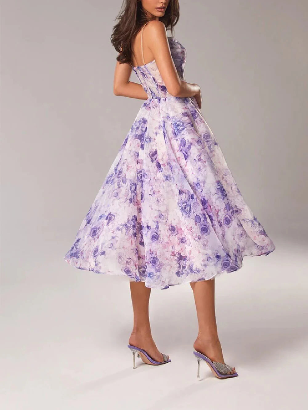 Strapless elegant midi dress with flowing skirt and delicate floral pattern perfect for garden parties