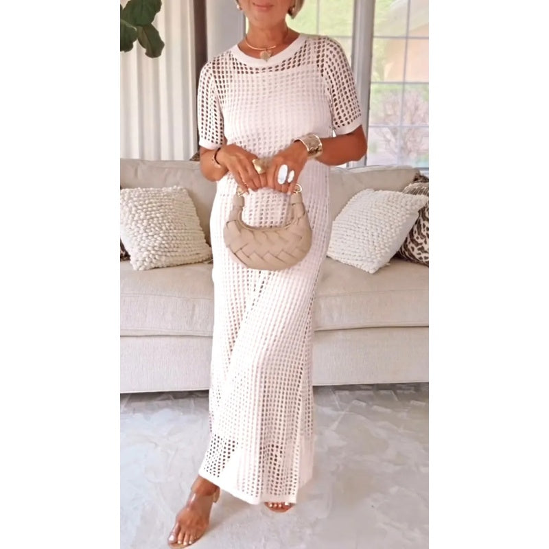 Woman modeling elegant maxi dress in casual home setting with natural light