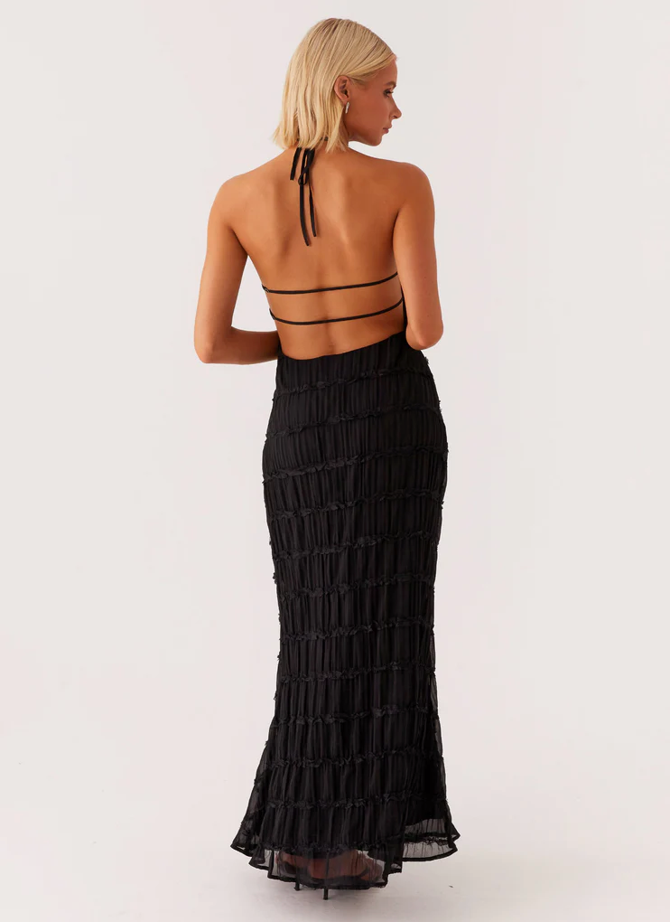 Side zipper detail on halter maxi dress ensuring streamlined fit