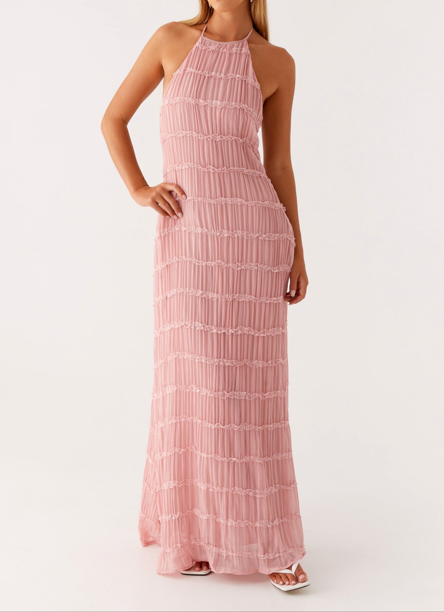 Yellow halter maxi dress featuring adjustable ties and formal silhouette