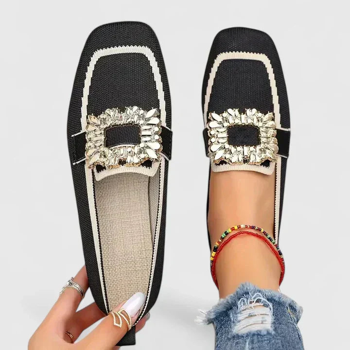 Side view of women's slip-on loafers with cushioned footbed and flexible sole for all-day comfort