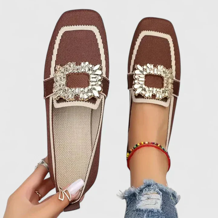Detail of embellished buckle and turquoise trim on women's supportive loafers