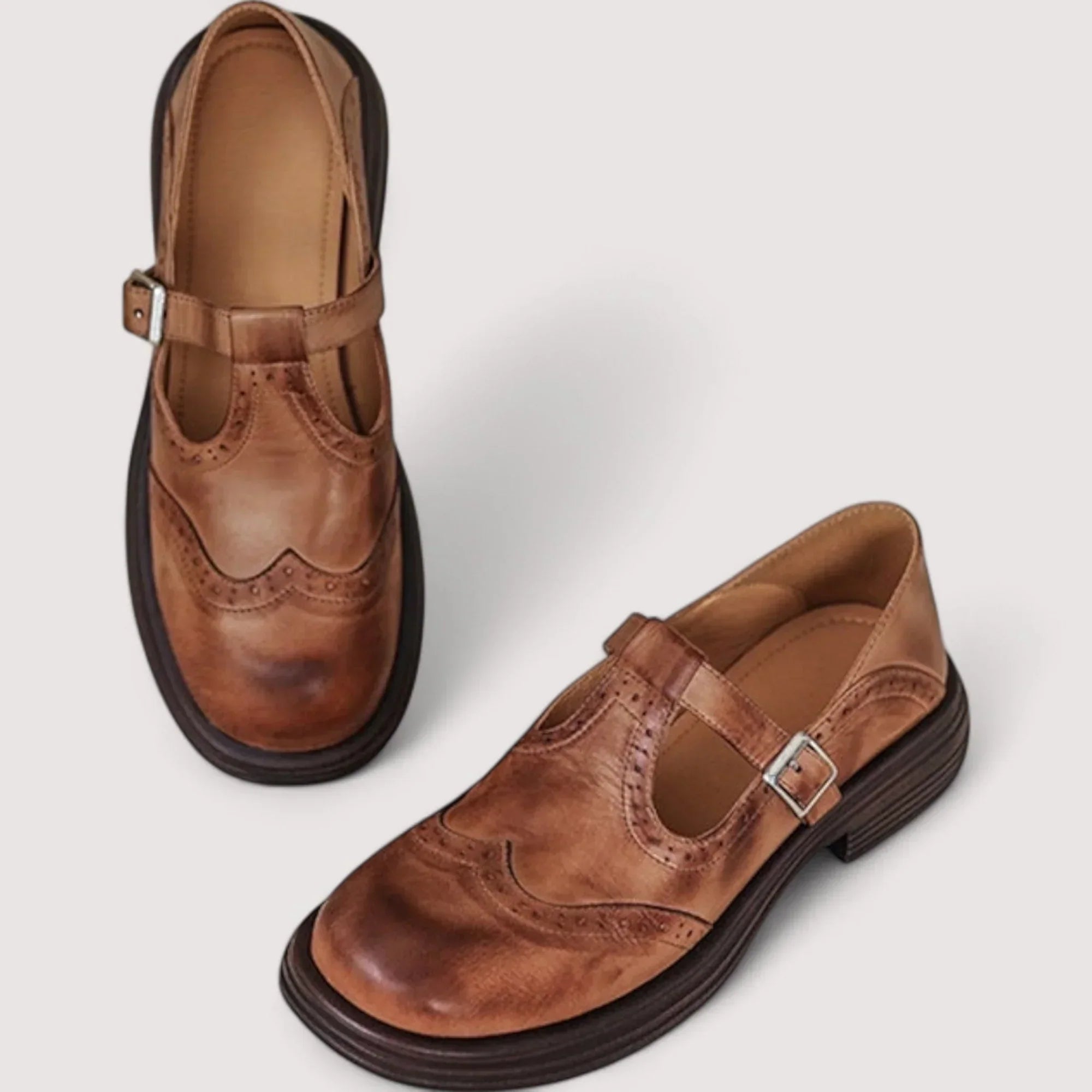 Side view of women's mary jane shoes with buckle strap and cushioned footbed for arch support