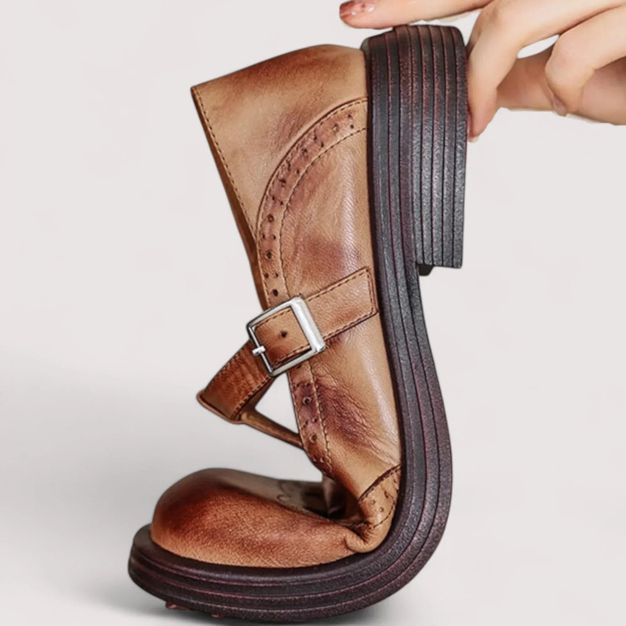 Top-down view of brown mary jane flats with classic silhouette and adjustable strap closure