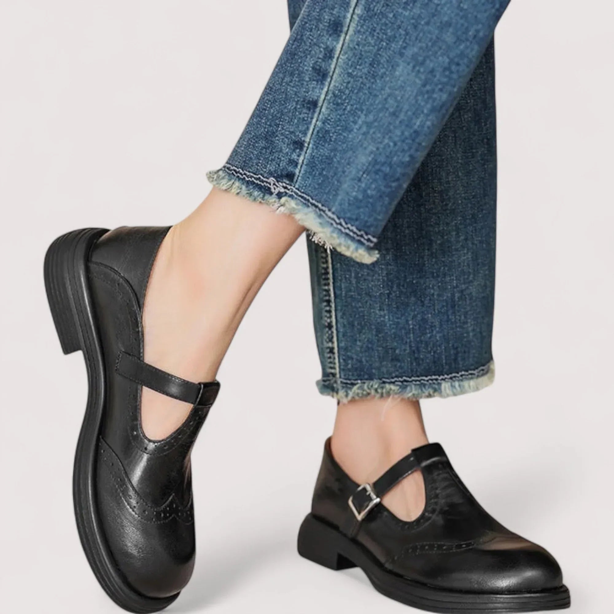Detail of brogue-style perforations and smooth finish on orthopedic mary jane shoes