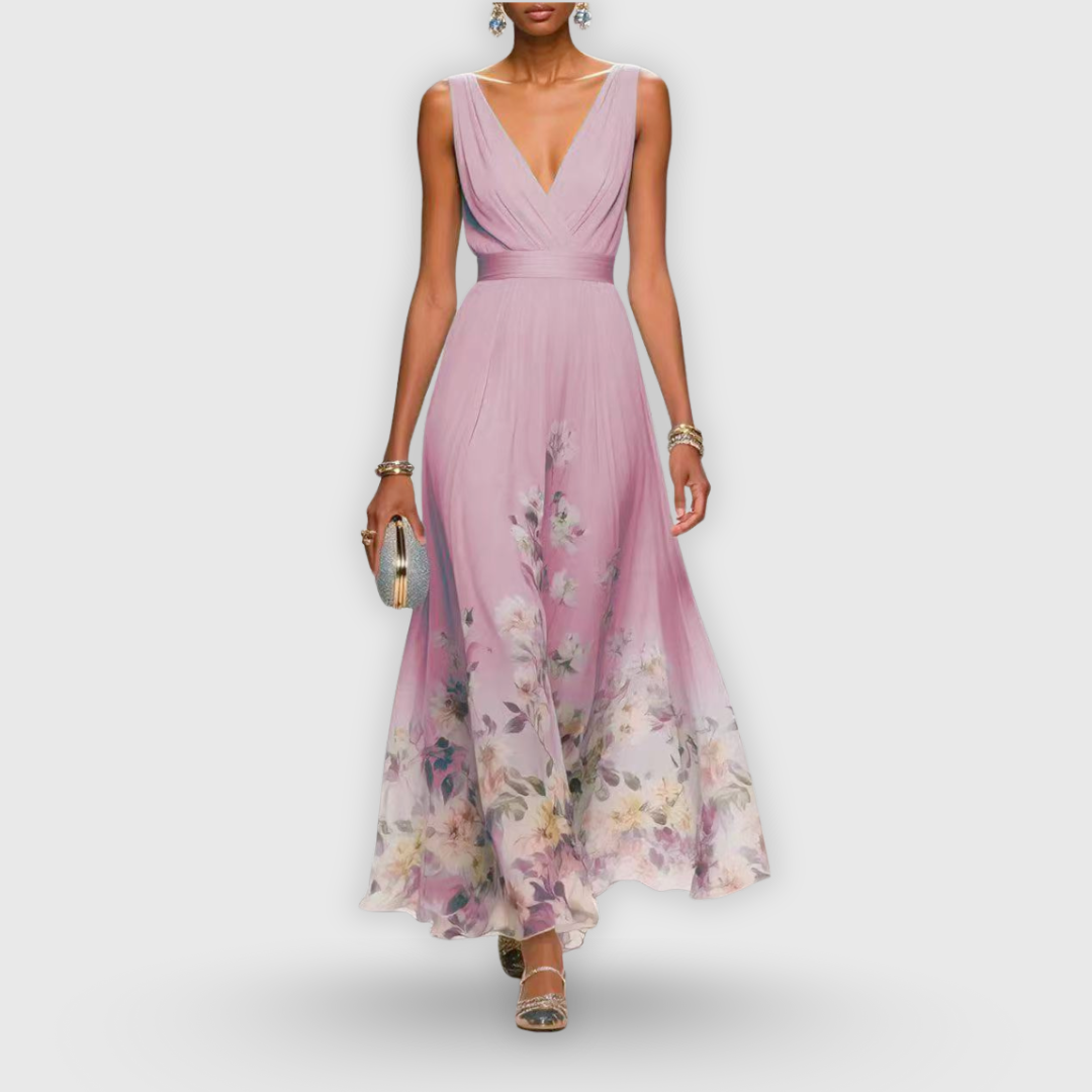 Floral maxi dress featuring wrap bodice and flowing A-line silhouette with sheer overlay