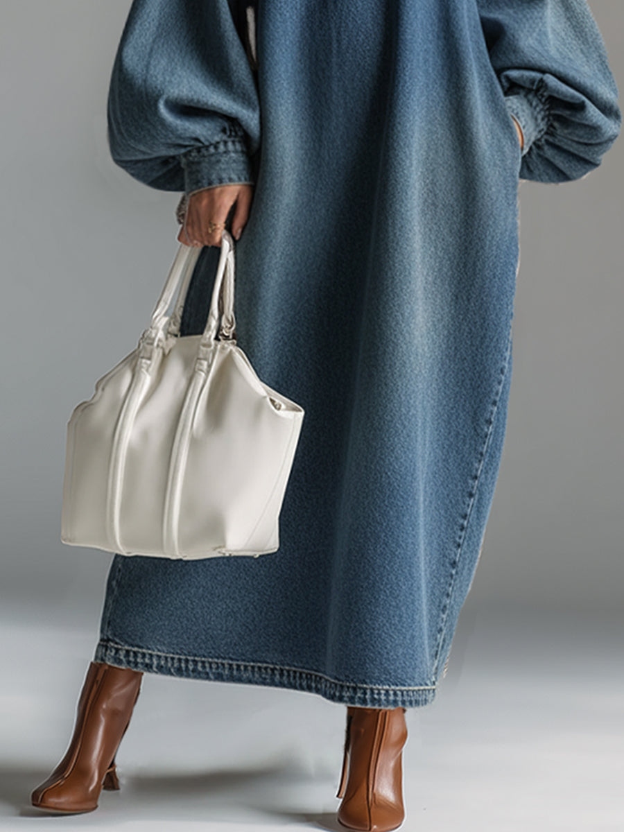 Full-length view of relaxed fit blue denim maxi dress with statement balloon sleeves